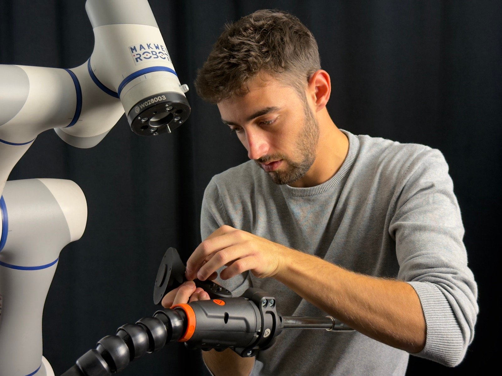 Technician setting up Makweld Robotix welding tool